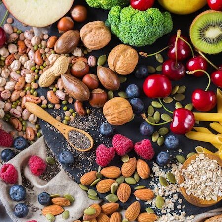 Healthy balanced dieting concept. Selection of rich fiber sources vegan food. Vegetables fruit seeds beans ingredients for cooking. Top view flat lay